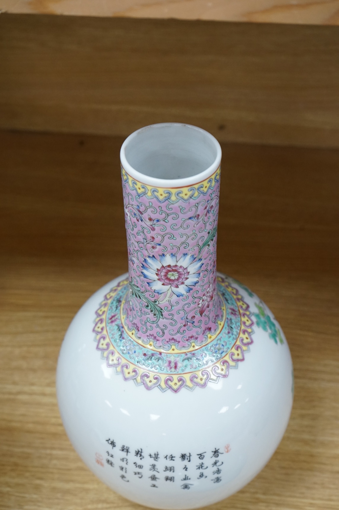 A Chinese famille rose vase, mid 20th century and a Chinese blue and white ‘boys’ dish, c.1900, vase 33cm high